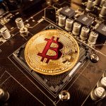 Gold Bit Coin BTC coins on the motherboard. Bitcoin is a worldwi